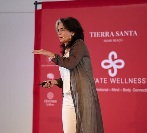 Nathalie Niddam speaking on stage